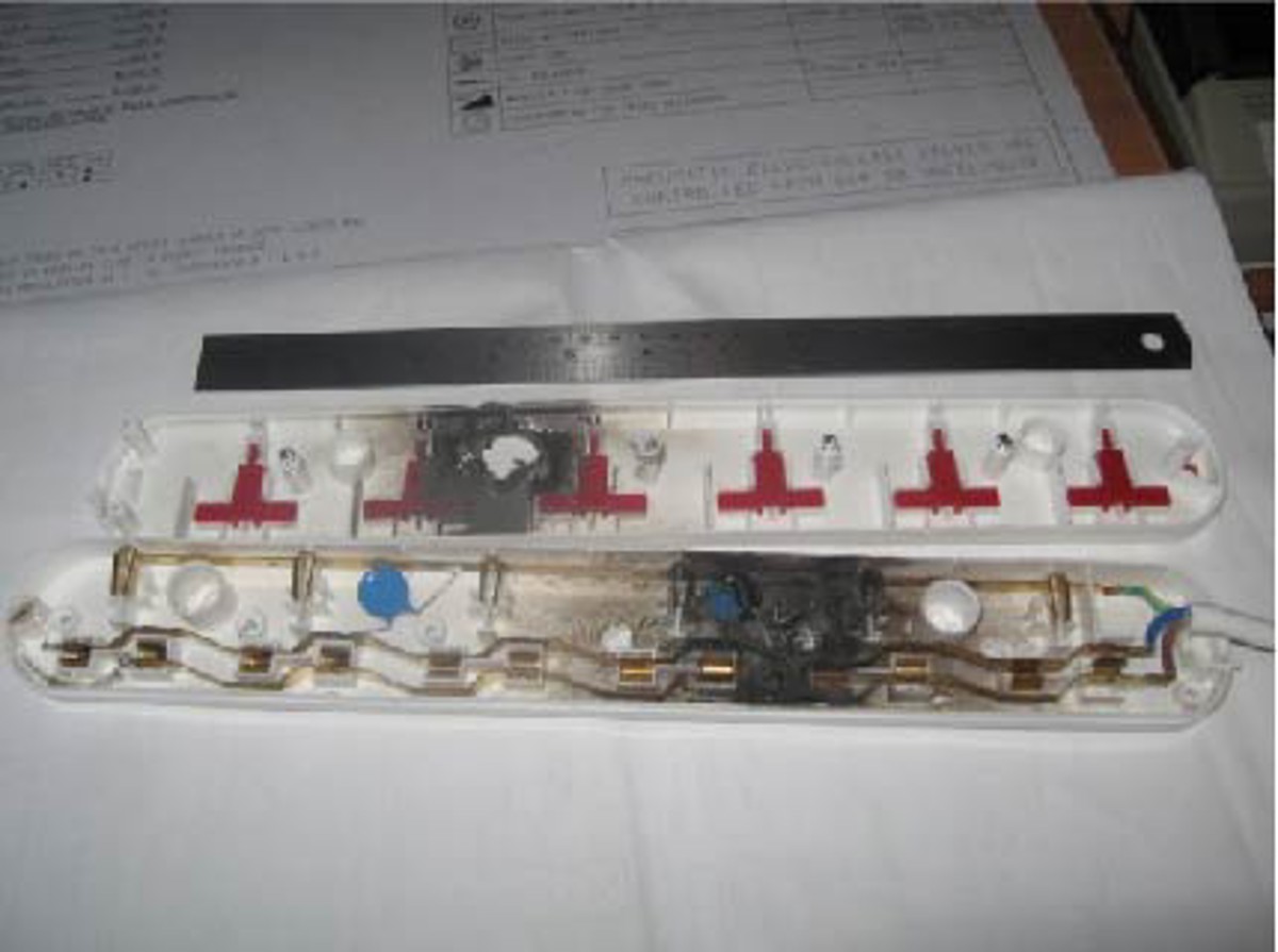 The inside of the 6 way socket extension, showing the damage caused inside the unit