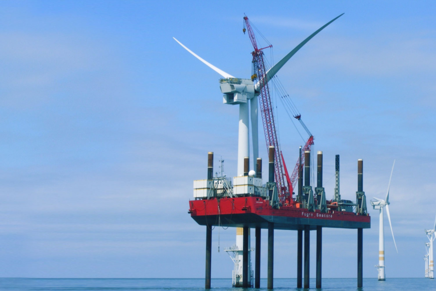 A photo of a Fugro jack up barge working on an offshore wind farm