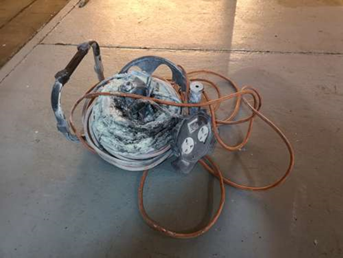 While ventilating a manhole in the engine room, the fire alarm was triggered when an electrical extension lead overheated, melting the insulation and started smouldering.