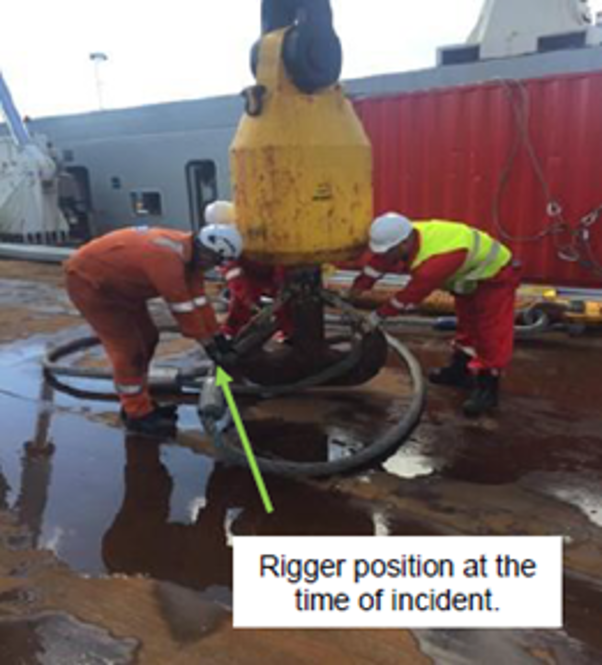 Post-incident – disconnecting wire rope slings with the crane hook lowered to the deck. Note, crane was positioned at waist height at the time of incident