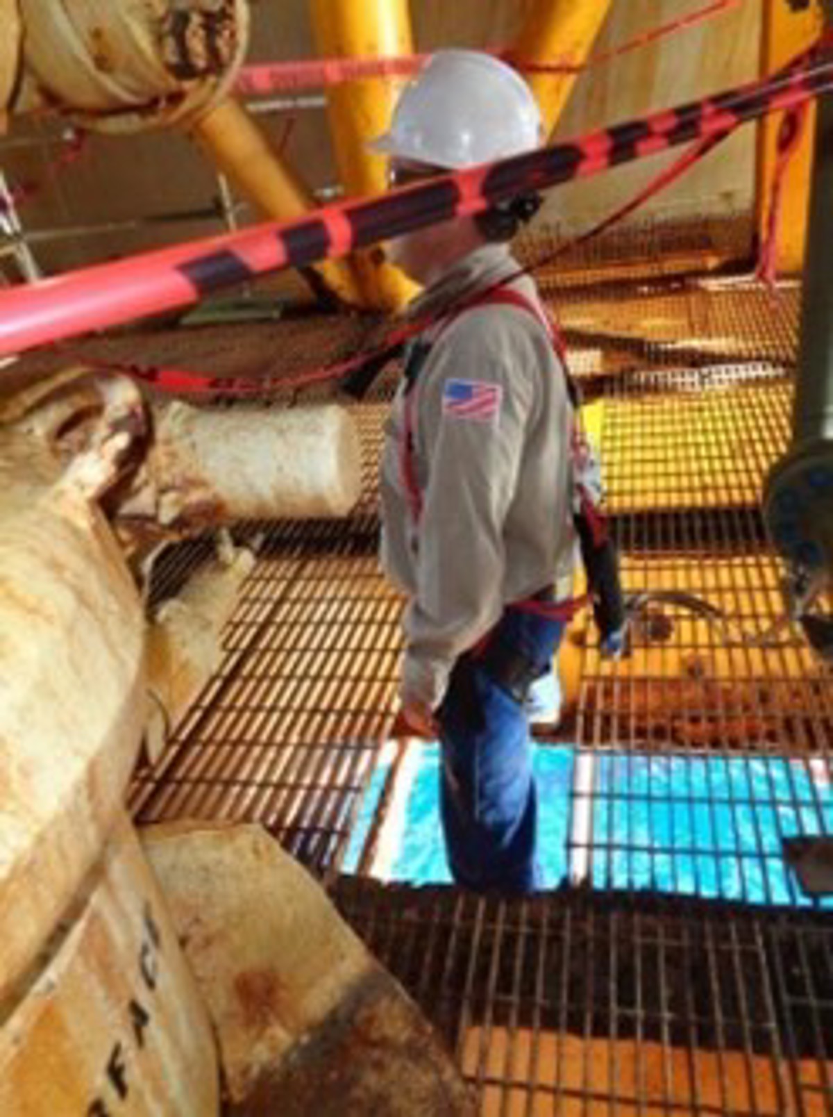 Post-incident photograph of person standing near the open hole