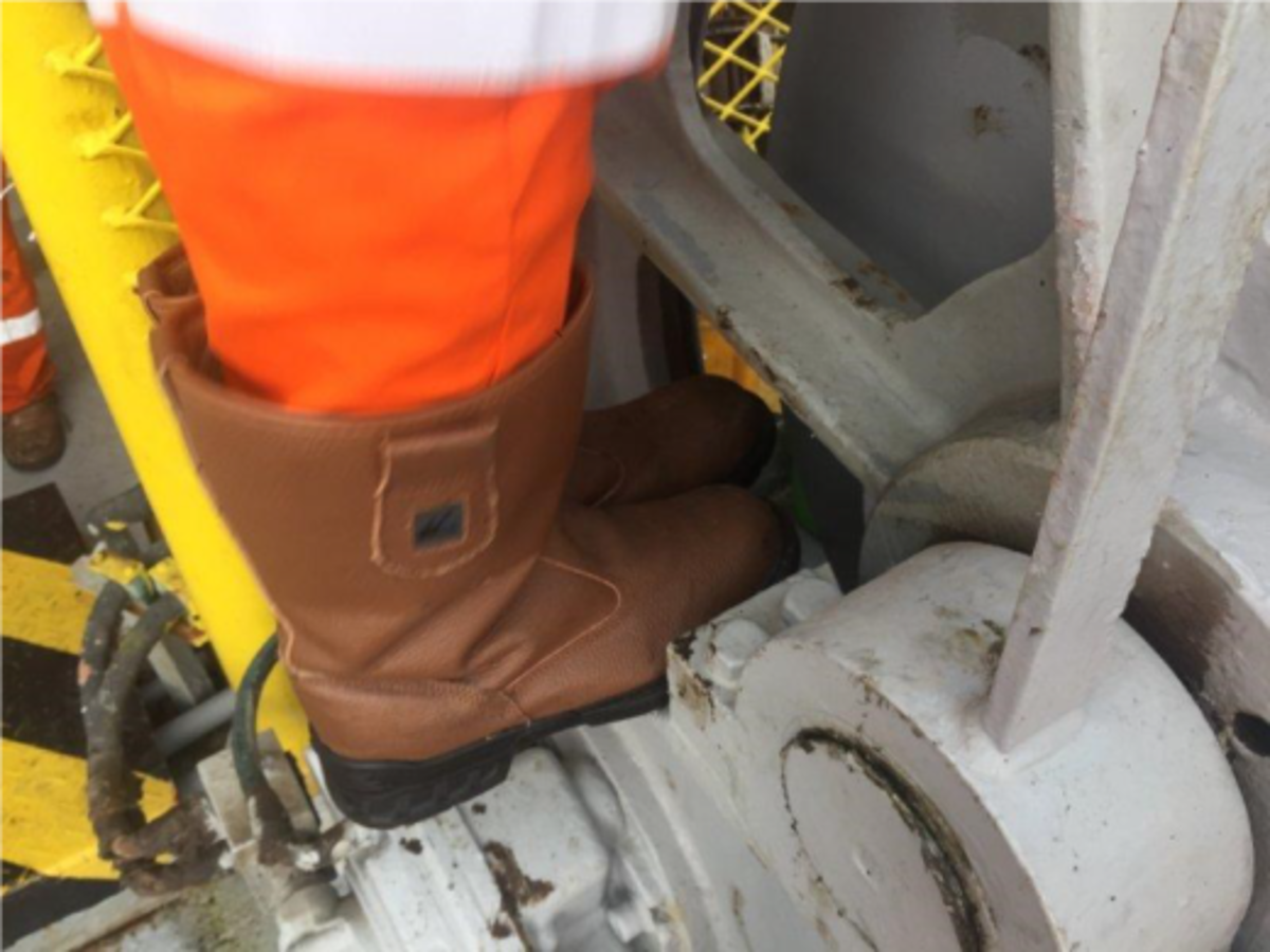 AB had both feet trapped by rotating winch drum; more serious injury was prevented by wearing the correct PPE