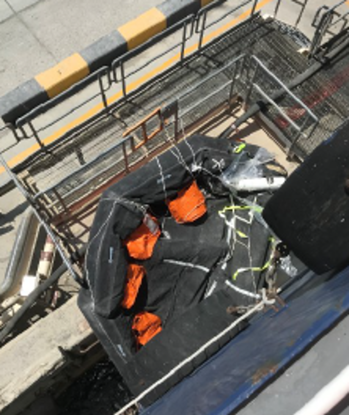 Life raft fallen onto quayside