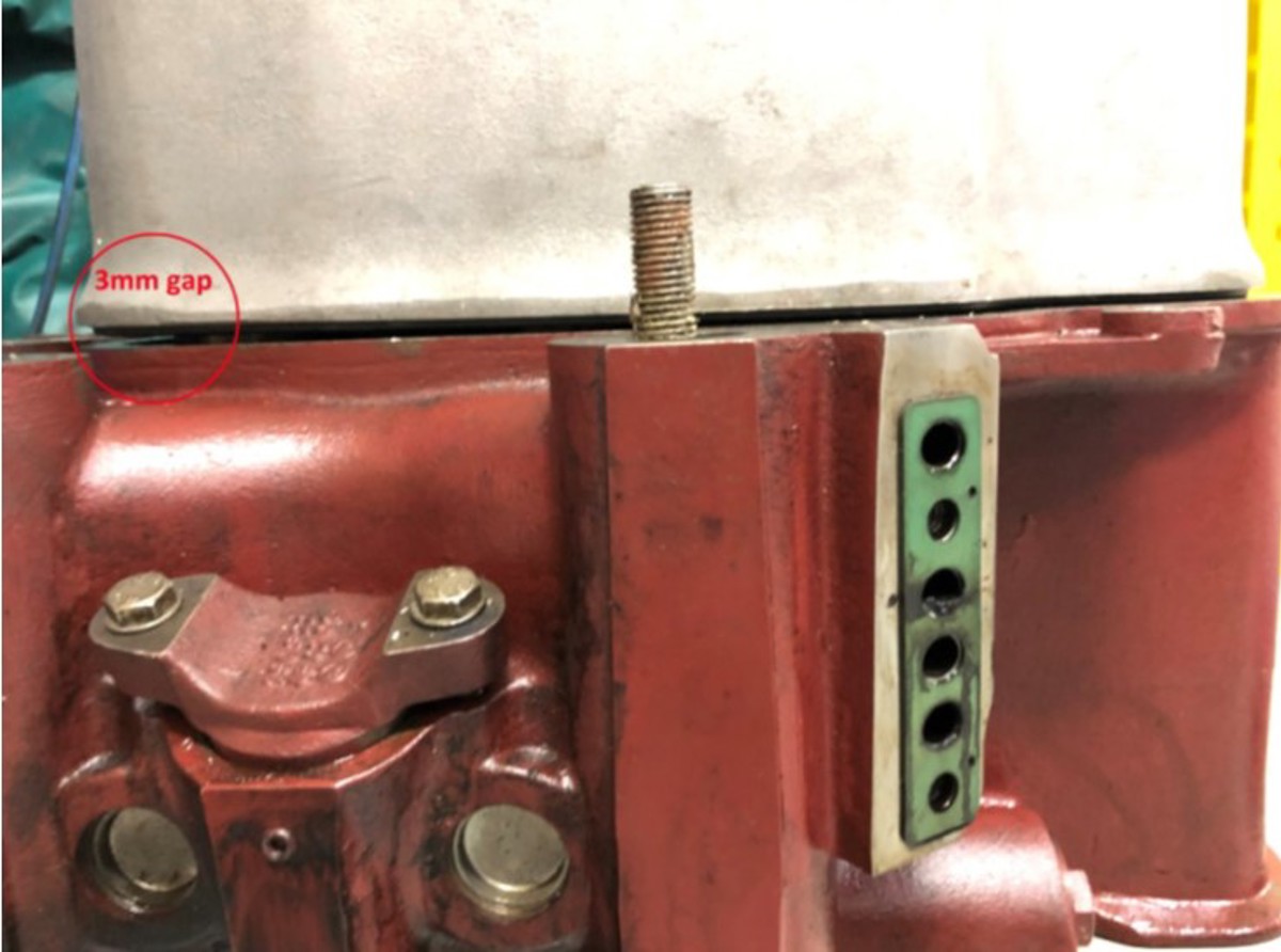 the cover of cylinder number one was not mounted correctly and the guide pin of the cover was not in the recess of the cylinder head on the exhaust side