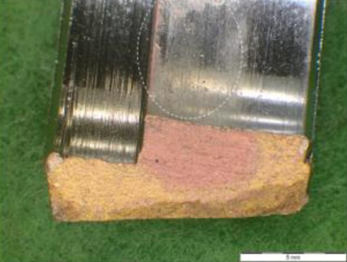 Failed nut showing some signs of coating removal and corrosion at point of a stress fracture