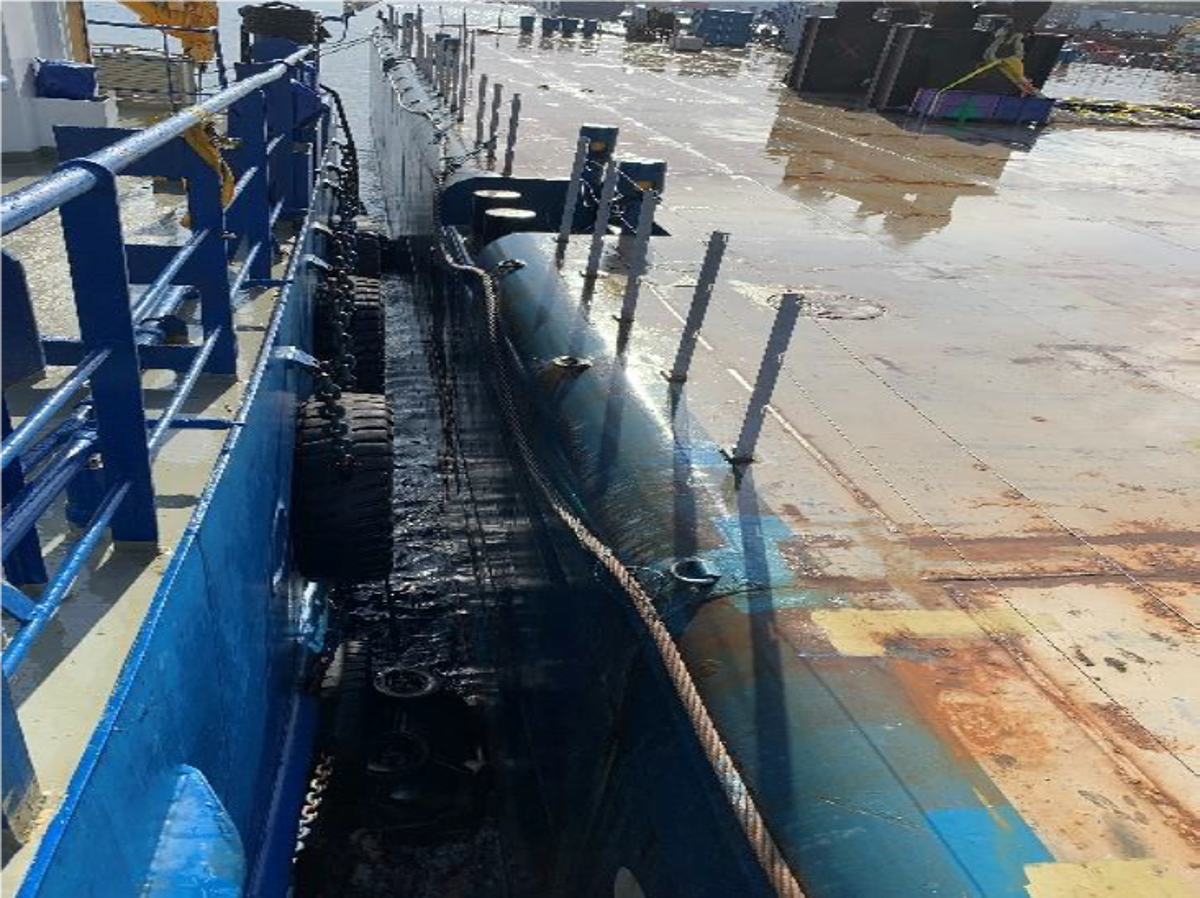 During preparations for disconnecting a tow tug which was moored to a barge in turn moored to the jetty, a crew member of the tow tug fell into water between the tow tug and the barge