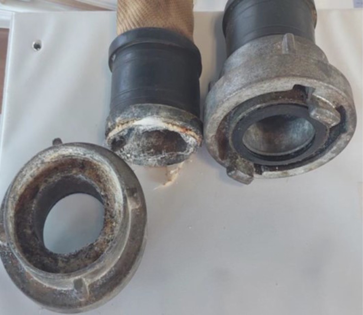 Electrolytic corrosion. Initial  investigation indicated that this hose  appeared to be of a different type from  most of the hoses onboard which were  made up with an aluminium ‘floating’  flange. This hose had a Storz ‘C’  coupling, which was thought to have  flanges fixed to the hose neck. Removal  of the rubber sleeve covering the  seizing wire revealed conventional  Monel seizing wire, and indications  were present that water had been  retained in the fabric outer sleeve  under the rubber sleeve